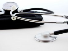 A photo of a stethoscope on a white surface.