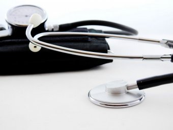 A photo of a stethoscope on a white surface.